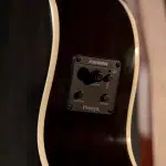 Close-up of a sunburst guitar showing a Fishman Presys preamp plate with volume, contour, and phase knobs. ขายราคาพิเศษ