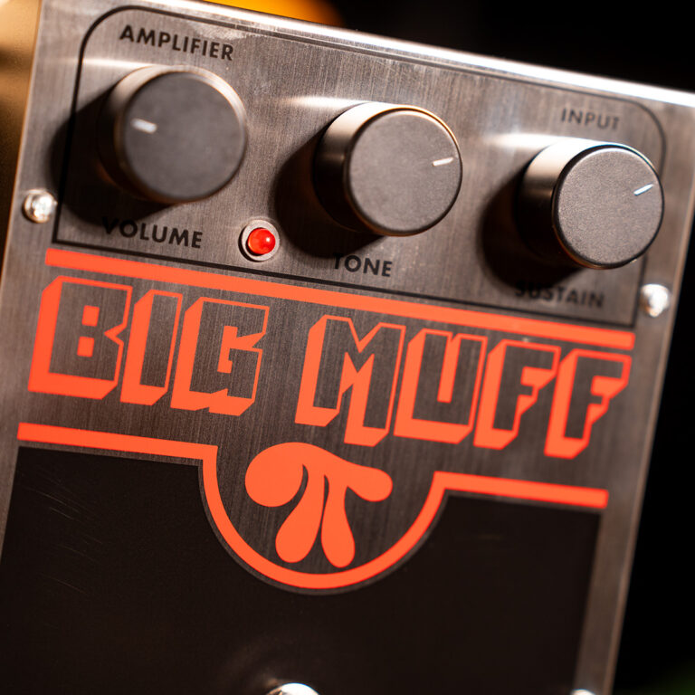Guitar effects pedal with three control knobs and a large red 'BIG MUFF' logo on a brushed metal faceplate. ขายราคาพิเศษ