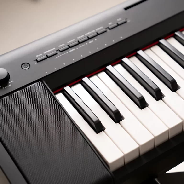 Close-up of a digital piano keyboard with built-in speaker grille and control panel above the keys. ขายราคาพิเศษ