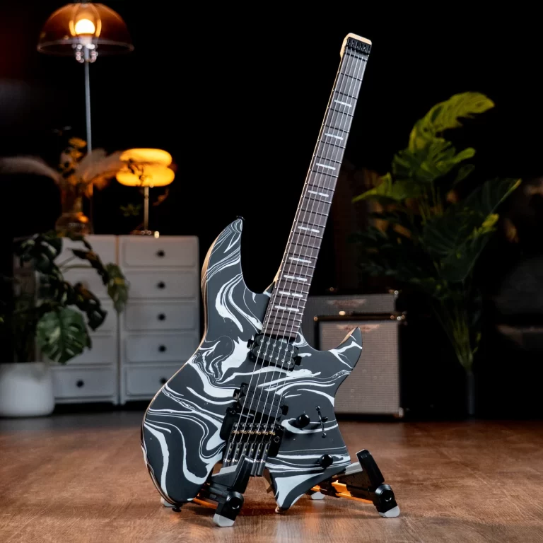 Electric guitar with a black-and-white marble finish on a stand in a dimly lit room. ขายราคาพิเศษ