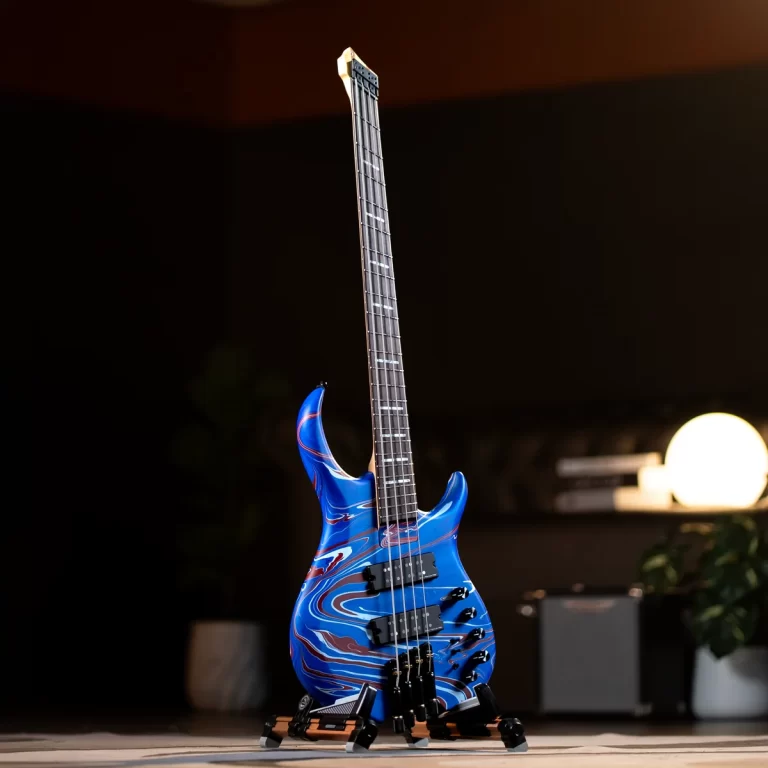 Blue marbled electric guitar with black pickups standing upright on the floor, pedals at its base. ขายราคาพิเศษ