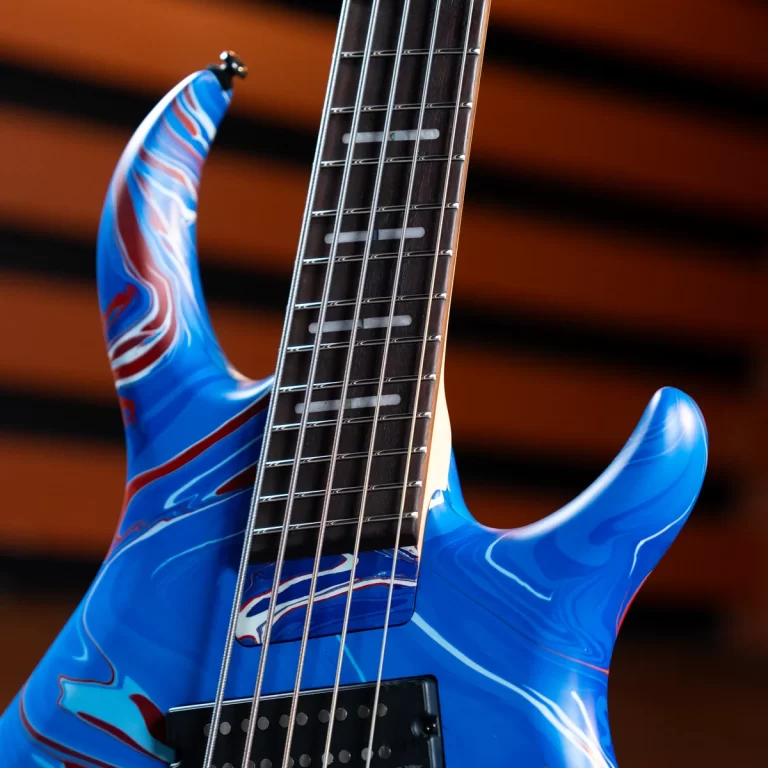 Close-up of a blue marbled electric guitar neck with strings and pickups visible ขายราคาพิเศษ