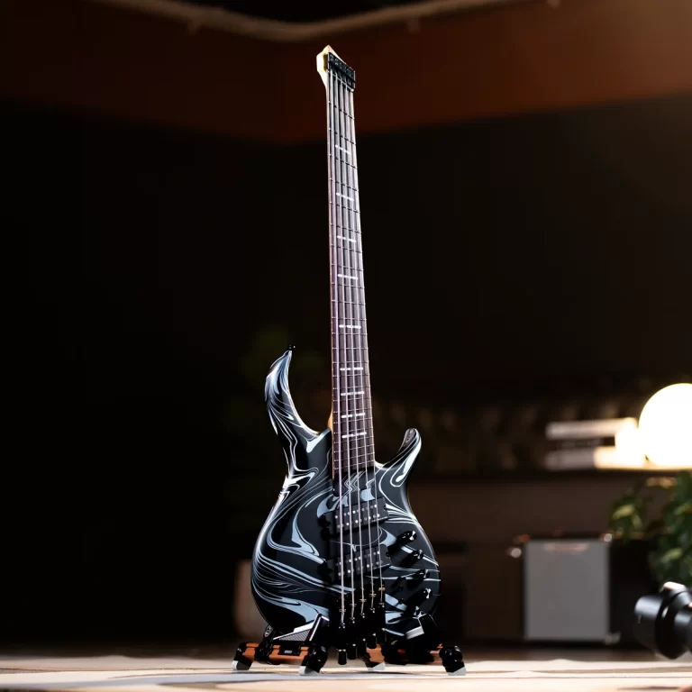 Electric guitar with a black-and-white marble pattern standing upright on a wooden floor. ขายราคาพิเศษ