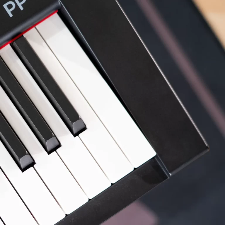 Close-up of a piano keyboard showing black and white keys arranged diagonally on a digital piano. ขายราคาพิเศษ