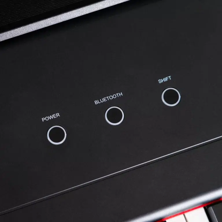 Close-up of three circular push buttons labeled Power, Bluetooth, and Shift on a black panel. ขายราคาพิเศษ
