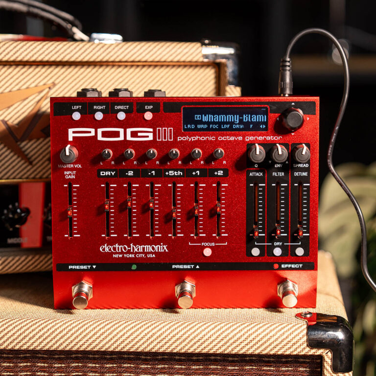 Red Electro-Harmonix POG polyphonic octave generator pedal on a guitar amp, with multiple sliders and knobs visible on a textured amp cabinet behind it. ขายราคาพิเศษ