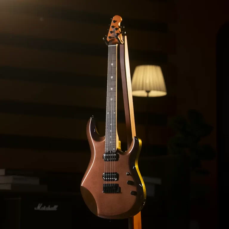 Electric guitar on a stand in a dim room with a warm lamp in the background, creating a cozy musical scene. ขายราคาพิเศษ