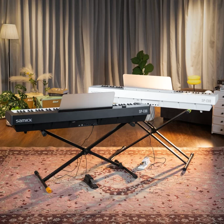 Two electronic keyboards on adjustable stands set up in a cozy living-room-style studio with a patterned rug and plants nearby. ขายราคาพิเศษ