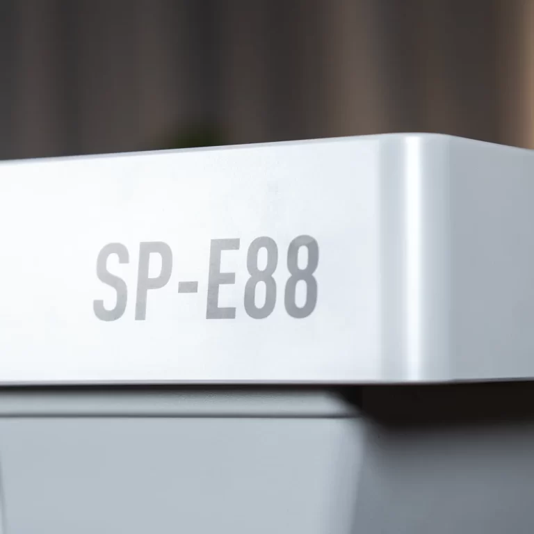White electronic device with the model number SP-E88 printed on the front panel. ขายราคาพิเศษ
