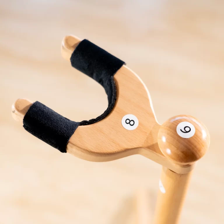 Close-up of a light wooden handle with black foam padding, featuring white stickers labeled 8 and 9. ขายราคาพิเศษ