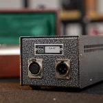 Back panel of a KA-47 device with two circular connectors (DIN/XLR) and a metal speckled finish, label reads KA-47 ขายราคาพิเศษ