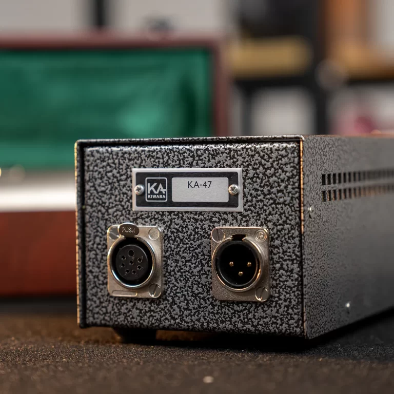 Back panel of a KA-47 device with two circular connectors (DIN/XLR) and a metal speckled finish, label reads KA-47 ขายราคาพิเศษ