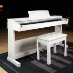 White piano with a matching white cushioned bench in a room, pedals visible underneath ลดราคาพิเศษ