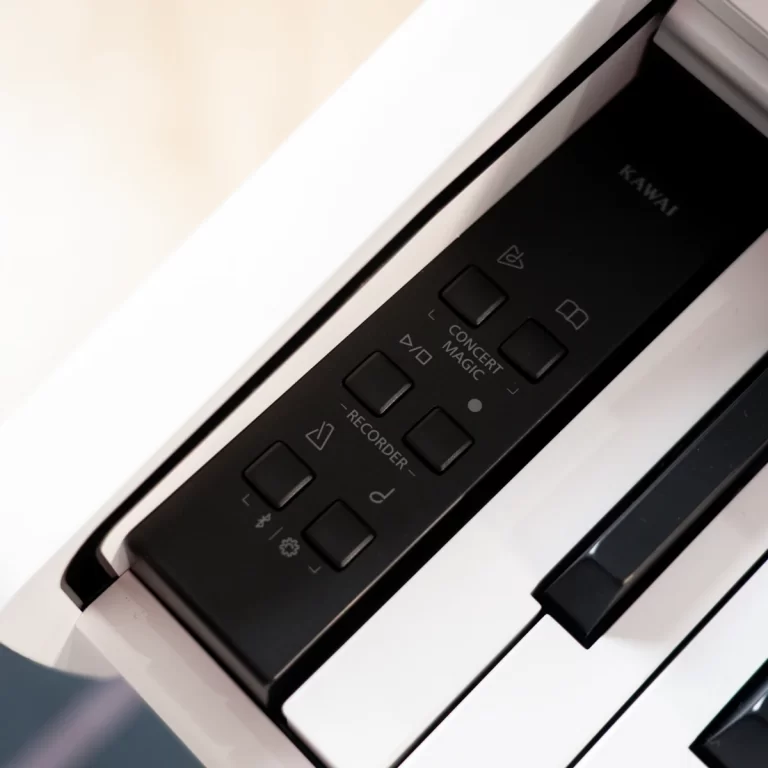 Close-up of a Kawai digital piano control panel with buttons labeled Concert Magic and Recorder beside white keys. ขายราคาพิเศษ