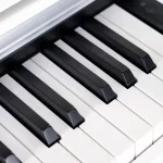 Close-up of black and white piano keys at an angle on a keyboard ขายราคาพิเศษ