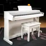 White upright piano with a white cushioned bench on a dark floor, pedals visible underneath. ลดราคาพิเศษ