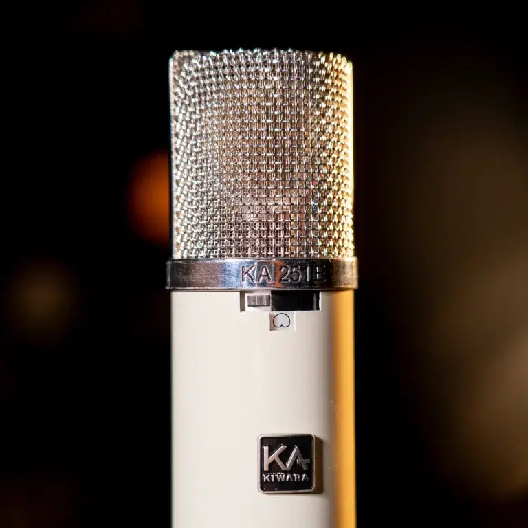 Close-up of a white studio microphone with a metal mesh grille and chrome ring marked KA 251; dark background. ขายราคาพิเศษ