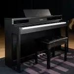 Samick black upright piano with matching bench in a music studio setting. ลดราคาพิเศษ