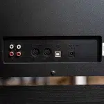 Back panel showing analog RCA input/output jacks, MIDI IN/OUT DIN ports, a USB port, and a DC power jack. ขายราคาพิเศษ