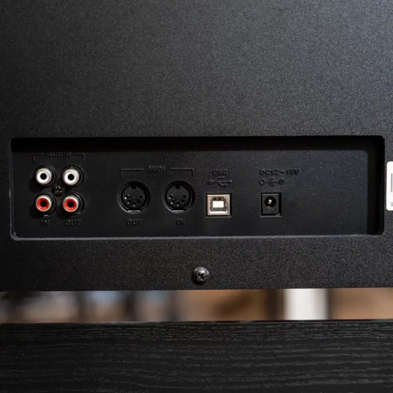 Back panel showing analog RCA input/output jacks, MIDI IN/OUT DIN ports, a USB port, and a DC power jack. ขายราคาพิเศษ