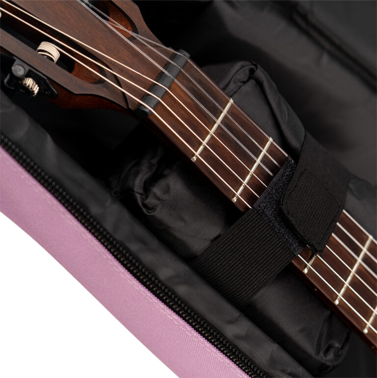 Close-up of a wooden guitar neck with strings and frets inside a black padded gig bag with a purple zipper visible at the edge. ขายราคาพิเศษ