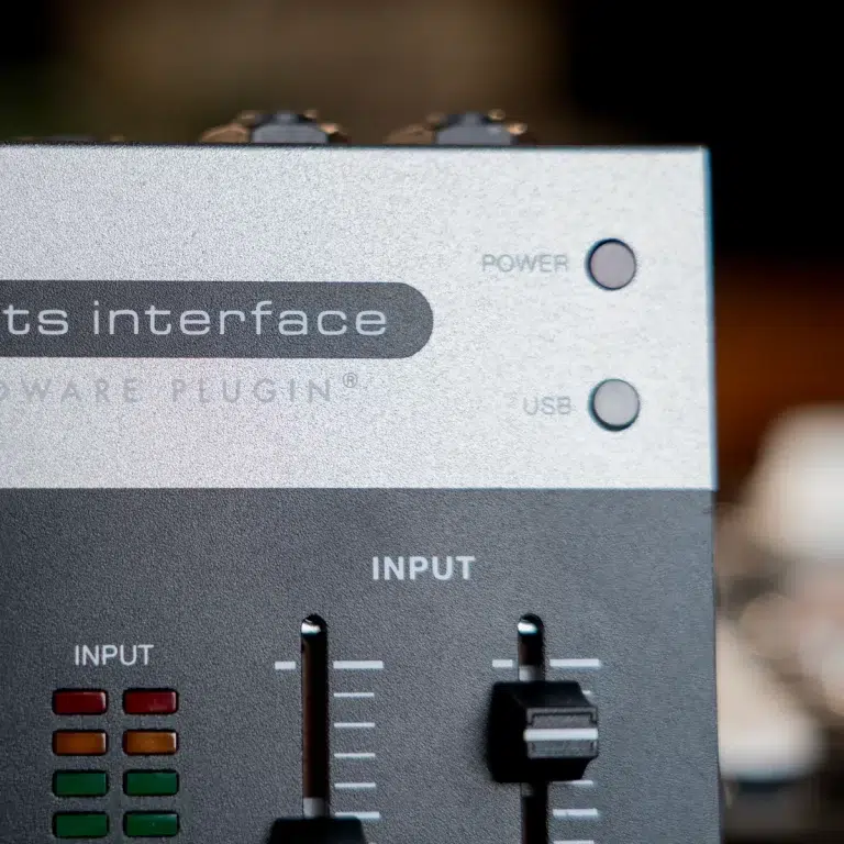 Portable audio interface front panel with power and USB indicators; input level fader and channel meters visible on the lower half. ขายราคาพิเศษ