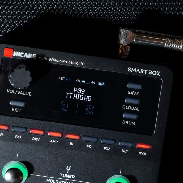 Close-up of a SMART BOX multi-effects guitar processor with a digital display, labeled buttons, and a green joystick knob. ขายราคาพิเศษ