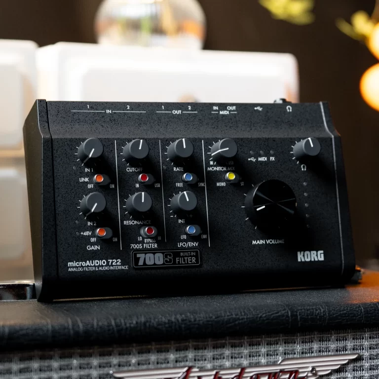 Close-up of a black Korg microAUDIO 722 analog filter and audio interface with multiple knobs and switches on a tabletop. ขายราคาพิเศษ