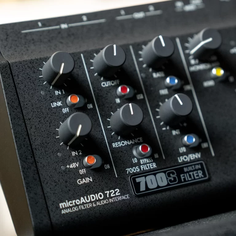 Close-up of a black MicroAudio 722 analog filter panel with knobs for IN1, IN2, CUTOFF, RESONANCE and GAIN. ขายราคาพิเศษ
