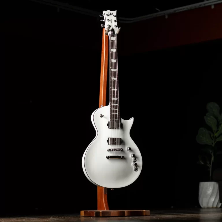 White electric guitar on a wooden stand, set against a dark background. ขายราคาพิเศษ