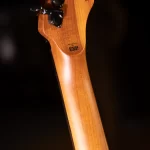 Close-up of a wooden guitar neck with a small 'DESIGNED BY ESP' stamp on the back of the headstock. ขายราคาพิเศษ