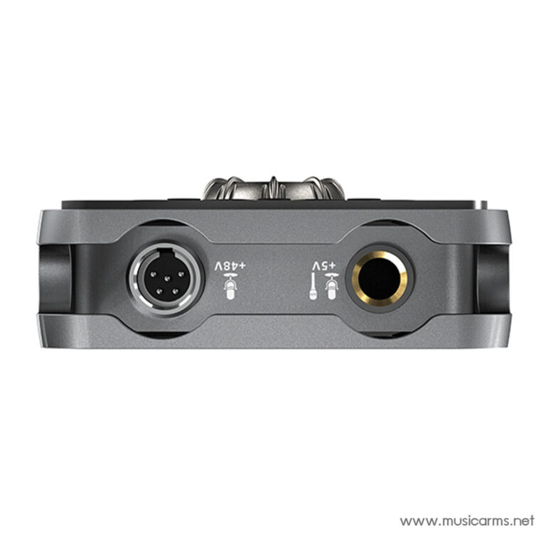 Bottom view of a gray audio device showing a 5‑pin round connector on the left and a gold‑ringed circular jack on the right. ขายราคาพิเศษ