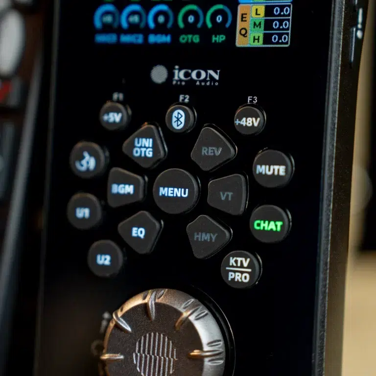 Close-up of an ICON Audio handheld control panel with blue-lit keys and a large dial. ขายราคาพิเศษ