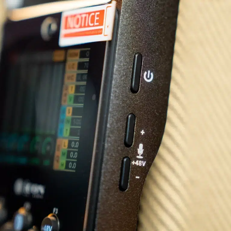 Close-up of an electronic device's side panel with a vertical power button and mic/+48V controls next to a touchscreen display, plus a red NOTICE sticker above. ขายราคาพิเศษ