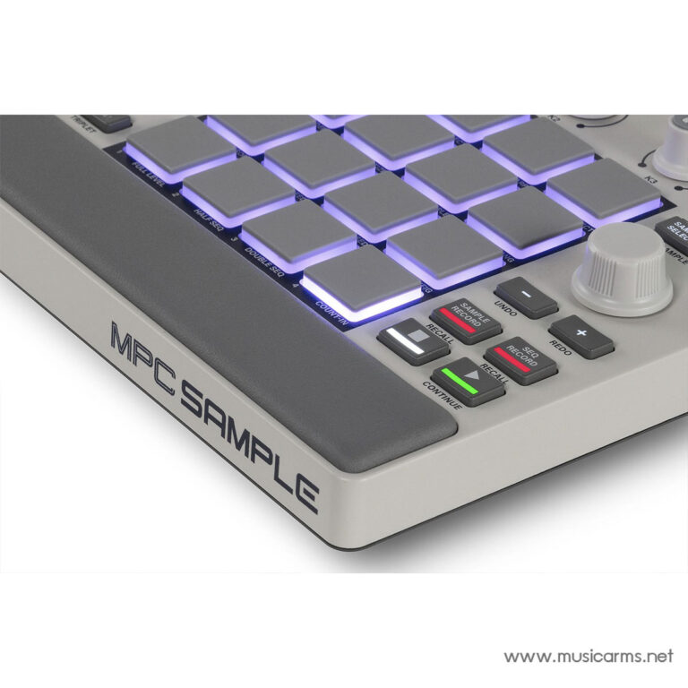 Close-up of an MPC-style pad controller with purple-lit square pads and labeled control buttons on a gray chassis, used for music production. ขายราคาพิเศษ