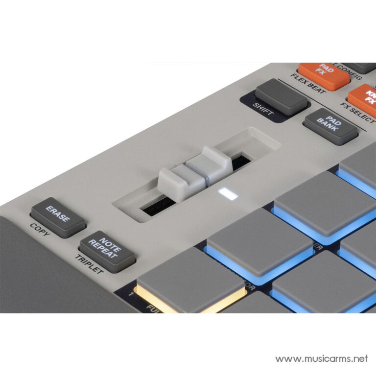 Close-up of a drum machine control surface with gray velocity pads and a white slider, labeled ERASE, COPY, NOTE REPEAT, and TRIPLETT nearby. ขายราคาพิเศษ