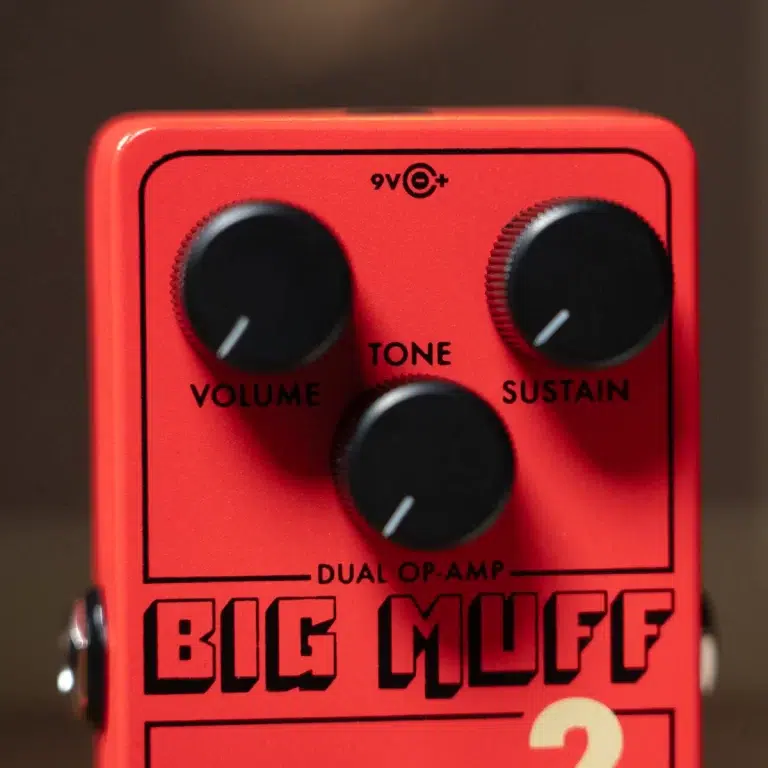 Orange Big Muff dual op-amp guitar pedal with three black knobs labeled Volume, Tone, Sustain. ขายราคาพิเศษ