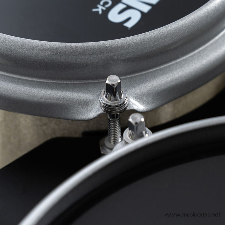 Close-up of a drum tension rod and lug on a silver drum shell with a dark head nearby. ขายราคาพิเศษ