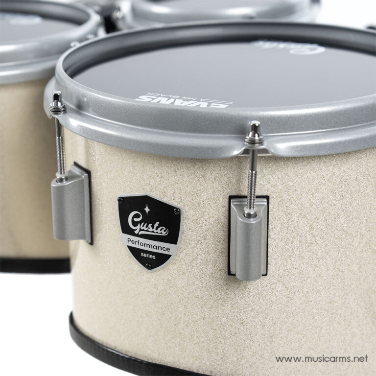 Close-up of a beige snare drum with silver rims, tension rods, and a Gusta Performance badge on the shell. ขายราคาพิเศษ