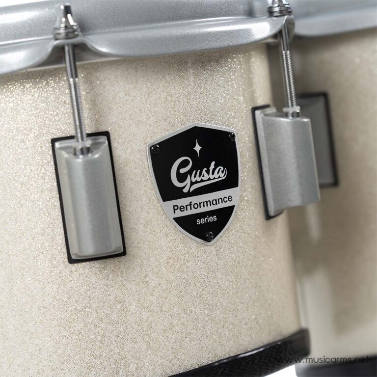 Close-up of a beige sparkle drum shell with a Gusta Performance series badge and metal lugs visible on the sides. ขายราคาพิเศษ