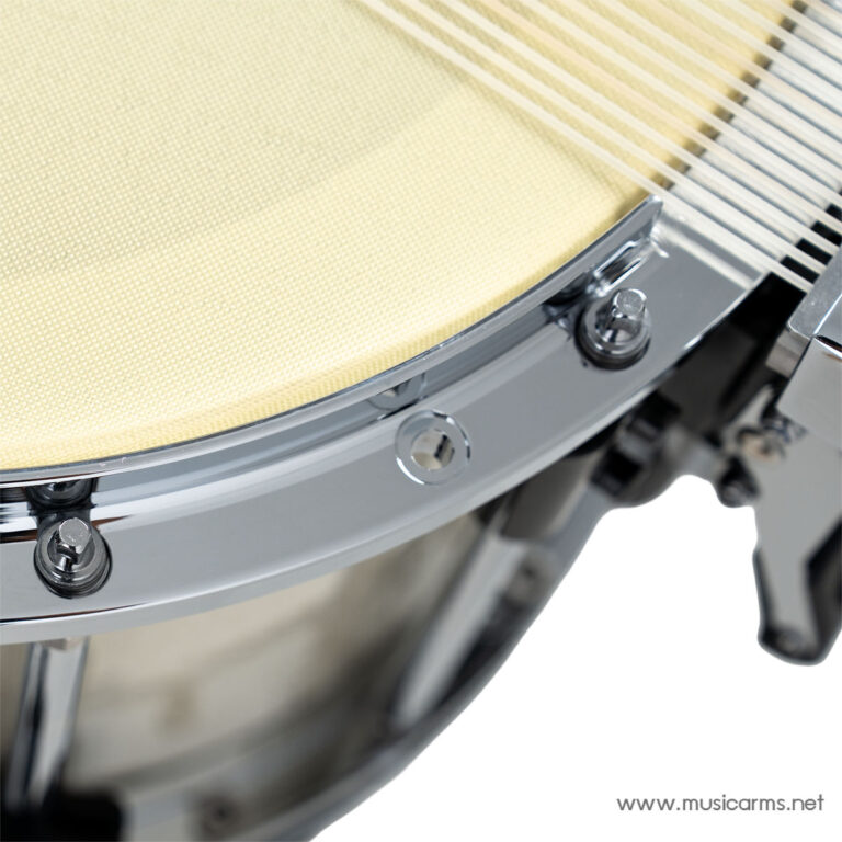 Close-up of a chrome drum hoop with tension rods on a beige drum head surface. ขายราคาพิเศษ