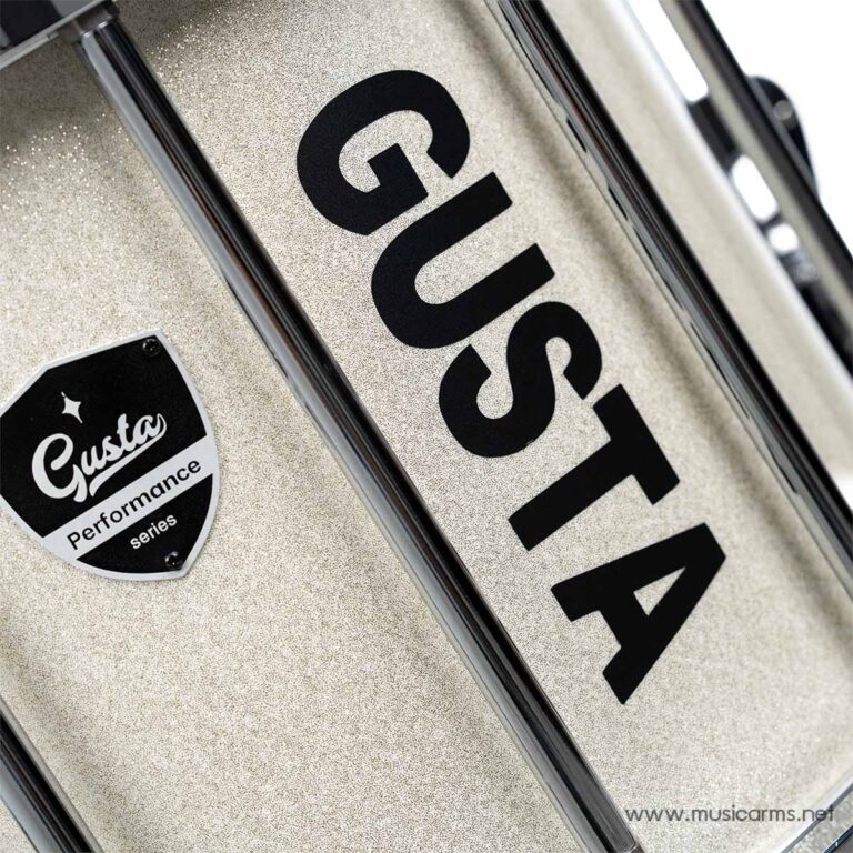 Close-up of a glittery drum shell with a bold black 'Gusta' logo and a 'Gusta Performance Series' badge visible on the surface. ขายราคาพิเศษ