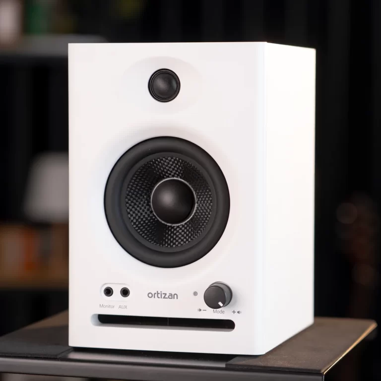 White rectangular speaker with a large black woofer and a smaller tweeter, Ortizan branding, and front controls on a white panel. ขายราคาพิเศษ
