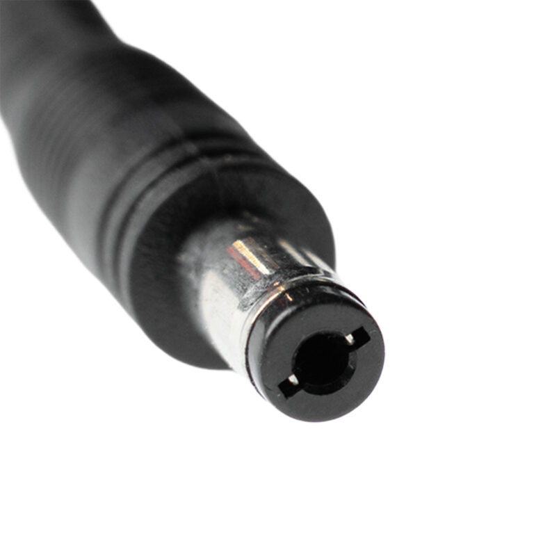 Close-up of a black cylindrical power connector plug end with a metal collar and hollow tip. ขายราคาพิเศษ