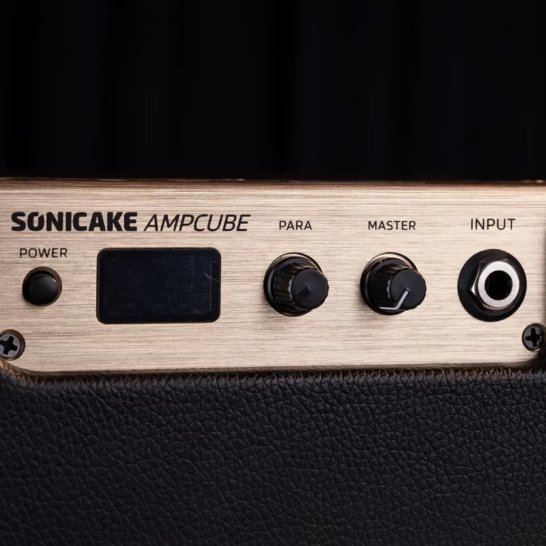 Close-up of a beige guitar amplifier control panel with a power button, small display, and knobs labeled PARA, MASTER, and INPUT jack visible below the surface ขายราคาพิเศษ