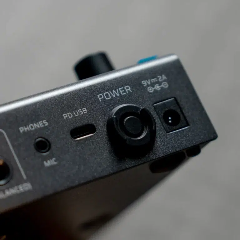 Close-up of a device's edge showing Power, PD USB, Phones, and Mic jacks with a circular power connector visible. ขายราคาพิเศษ