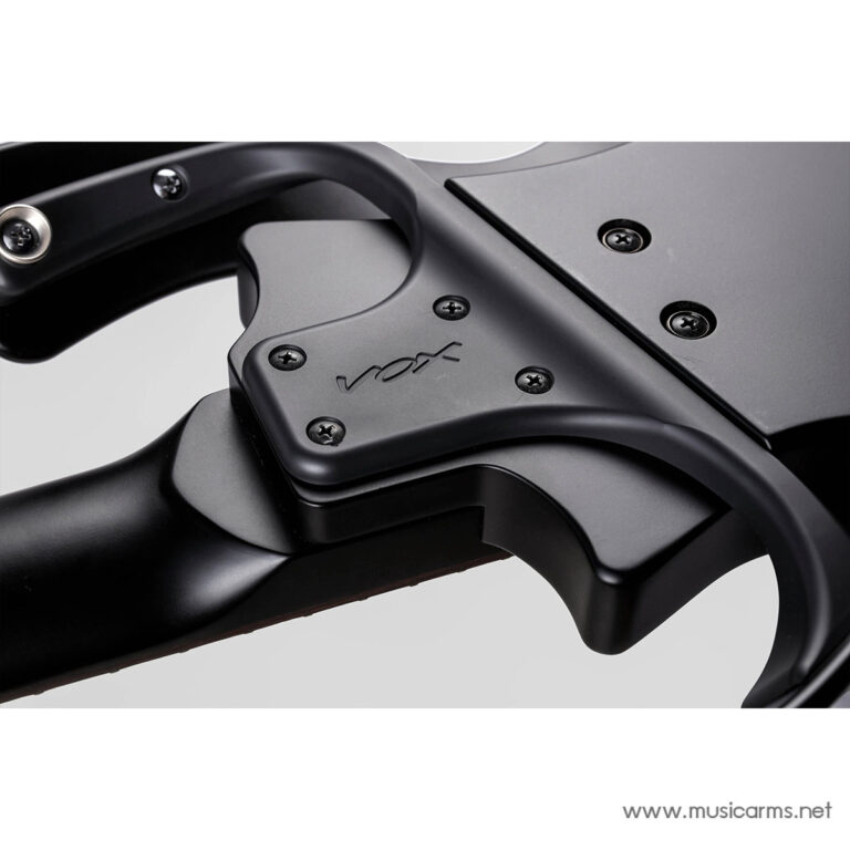 Close-up of black guitar hardware: a clamp with screws and a subtle logo on a matte finish surface, mounted on a guitar neck area ขายราคาพิเศษ