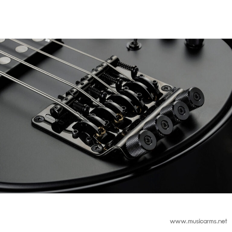 Close-up of a black electric bass bridge with steel strings and fine tuners on a dark body ขายราคาพิเศษ