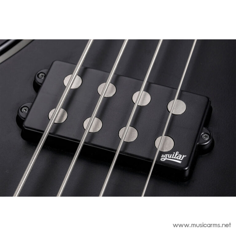 Close-up of a black Aguilar bass pickup with four metal pole pieces and four strings crossing over it on a dark guitar body ขายราคาพิเศษ