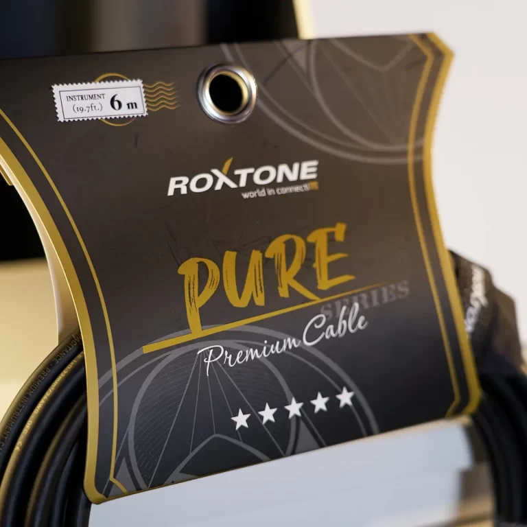 Roxtone Pure Premium Cable label with dark background, gold accents, and five-star graphics. ขายราคาพิเศษ